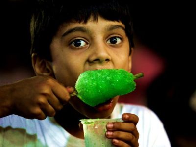 People eating ice cream at a ice cream parlour on Girgaum Chowpatty. Express photo by Prashant Nadkar, 14th April 2017, Mumbai.